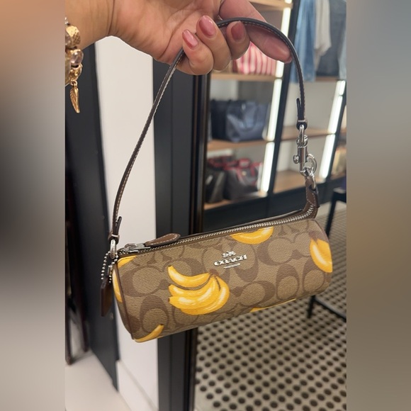 💰SALE💰 NWT Coach Nolita Barrel Bag in Signature Canvas with Banana Print - Picture 1 of 7